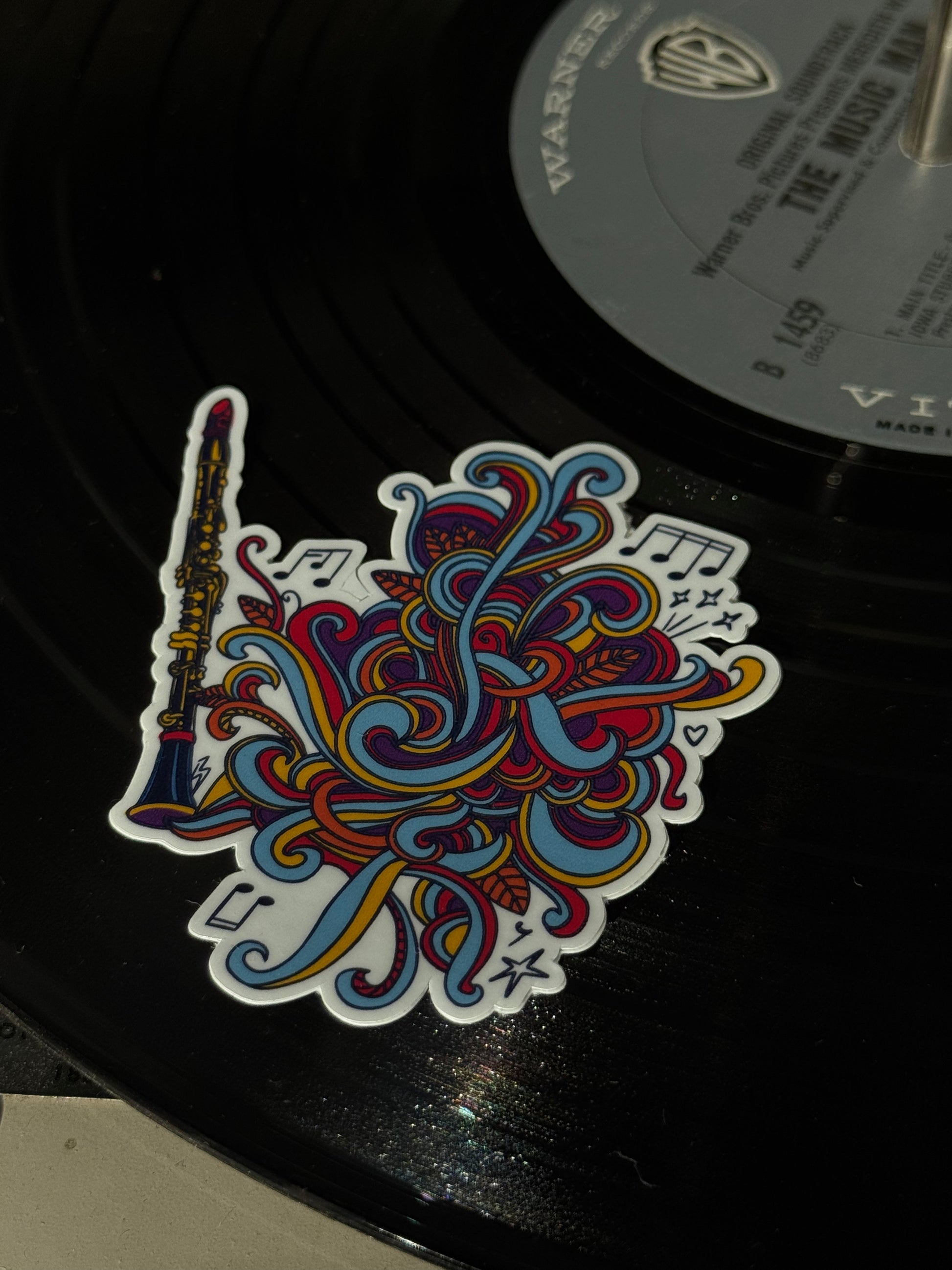 Colorful abstract Clarinet design sticker on a vinyl record 
