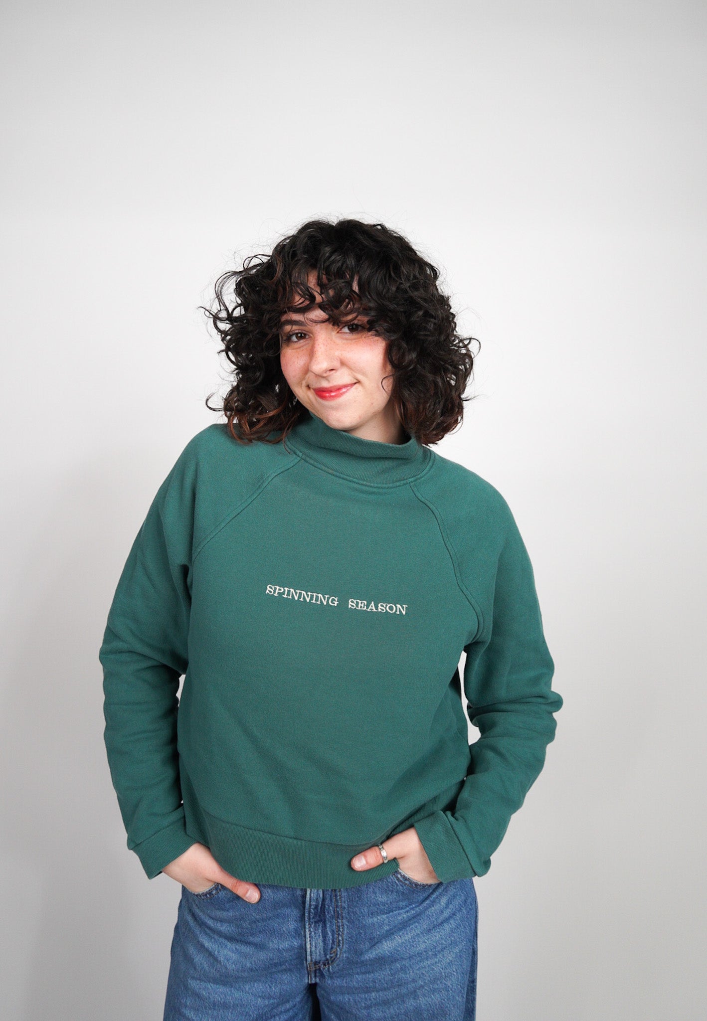 MEDIUM Green Mock Neck Crop with "Spinning Season" design