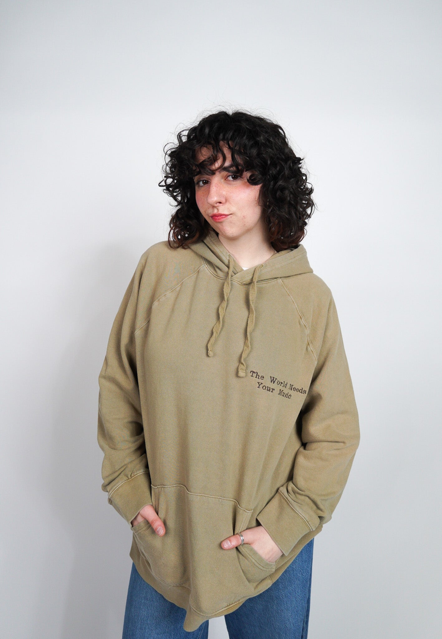 XLARGE -GOODFELLOW- Hoodie with "The World Needs Your Music" design