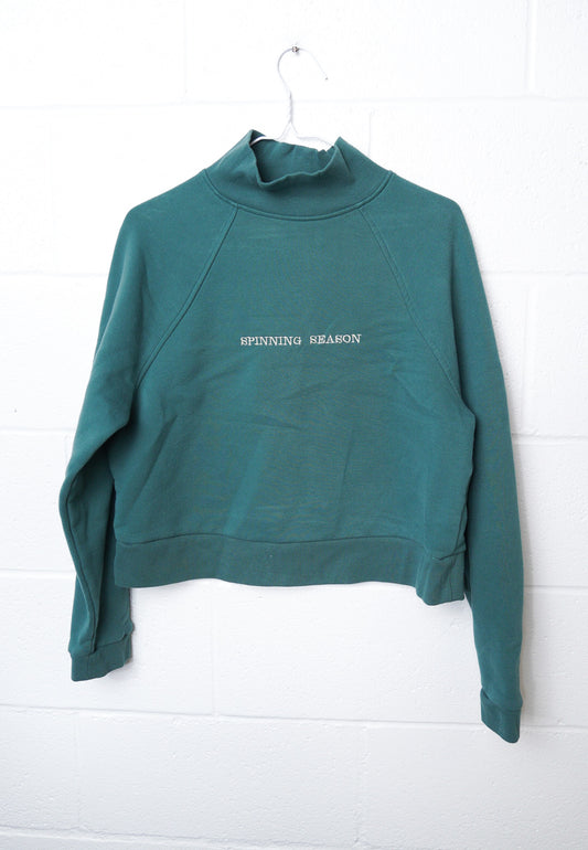 MEDIUM Green Mock Neck Crop with "Spinning Season" design