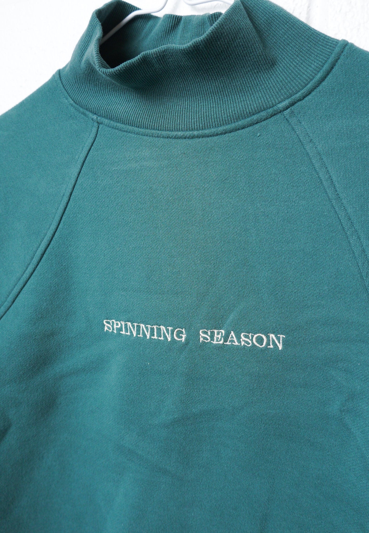 MEDIUM Green Mock Neck Crop with "Spinning Season" design