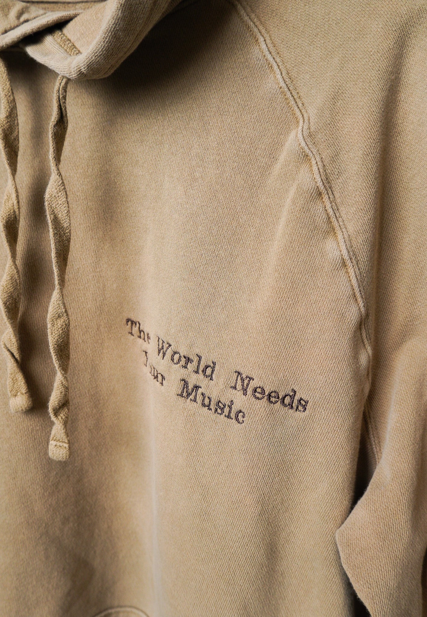 XLARGE -GOODFELLOW- Hoodie with "The World Needs Your Music" design