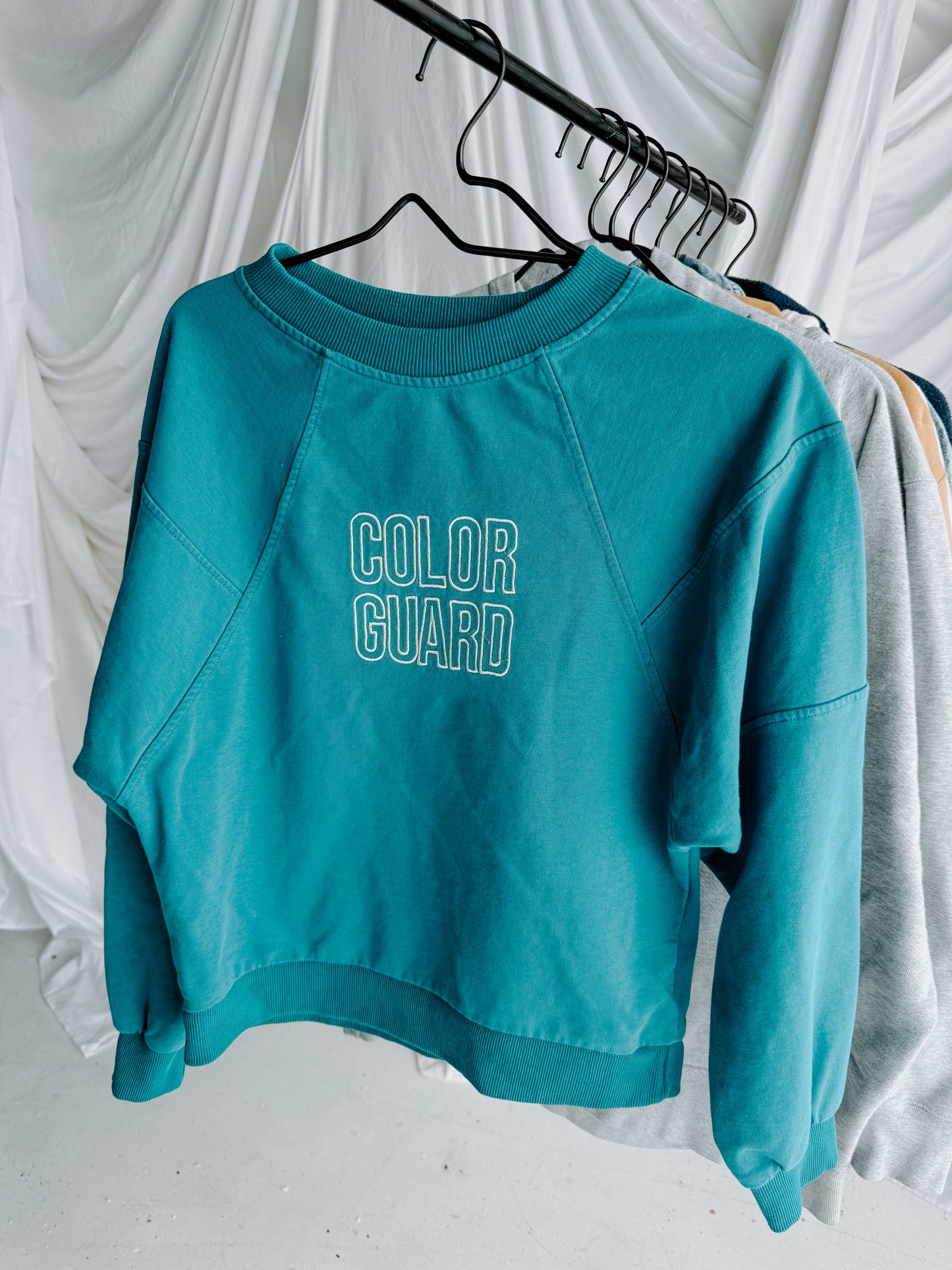MEDIUM Teal Blue Cropped Crewneck with block "COLOR GUARD" design