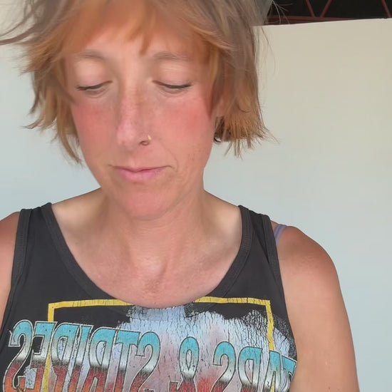 Video of girl putting on a one more time hat