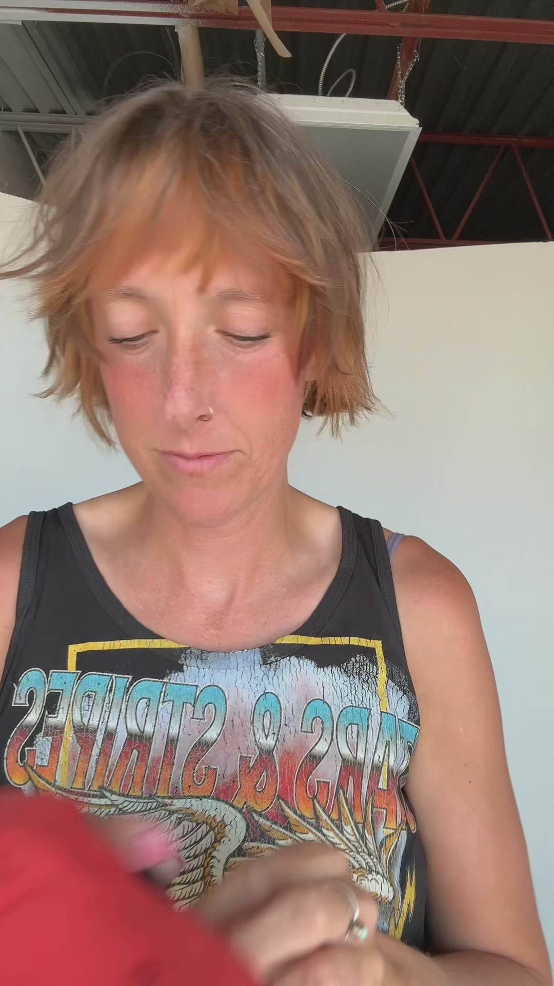 Video of girl putting on a one more time hat